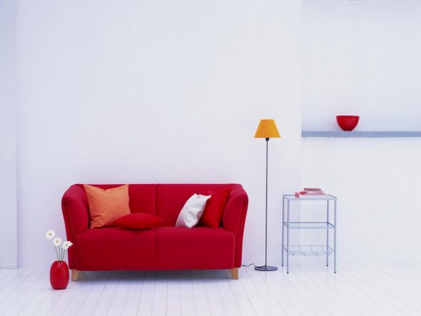 white walls red sofa