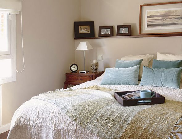 Colored shelves above the bed