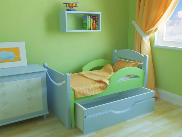 bed with bumpers in the nursery
