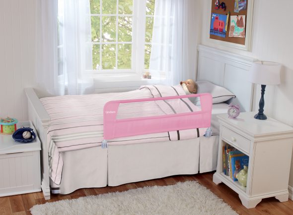 white children's bed with a side