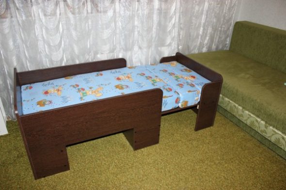 Children's sliding bed from a chipboard