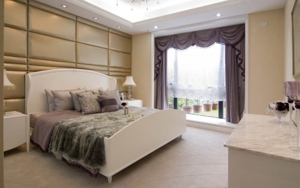 bed in a spacious bedroom