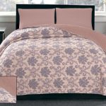 Beautiful bedspread on a double bed photo