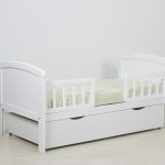 white bed with sides to the nursery