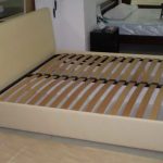 Bed with wooden slats at the base