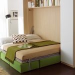 beds with a pistachio-colored sofa