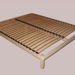 Slats in the base of the wooden bed