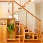shelves and cabinets under the stairs