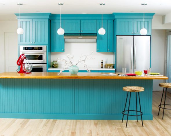 Turquoise kitchen set in combination with light walls and floor