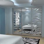 Sliding wardrobe in a bedroom with mirrors