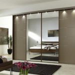 Sliding wardrobe in a bedroom with a mirror