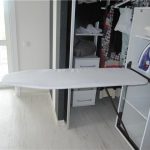ironing board in the cabinet