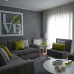 gray sofa with pistachio pillows in the living room interior