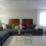 gray sofa in the living room · living room interior