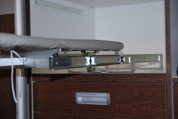 built-in ironing board in the closet mechanism