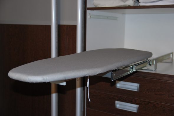 built-in ironing board in the closet surface