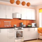 white kitchen set with orange