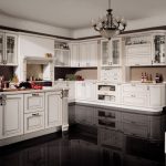 white kitchen set with a dark floor