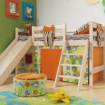 children's bed with a slide in the room