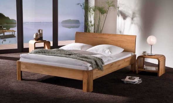 pojedyncze drewniane łóżko