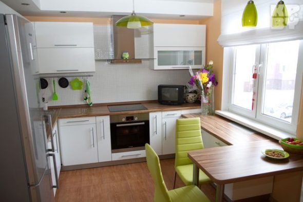 bright kitchen with a green accent