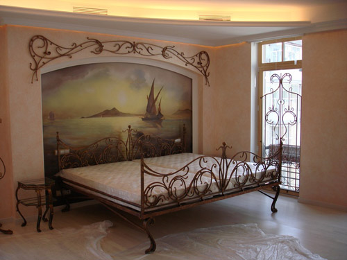 Wall mural at the head of the bed - a simple and stylish design room