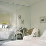 bright bedroom with mirrors