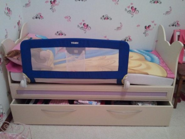bed with a removable side
