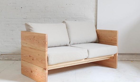 the sofa is made of natural wood