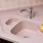sink in pink artificial stone countertop