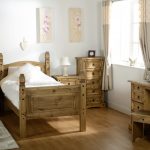 wooden bed in the bedroom