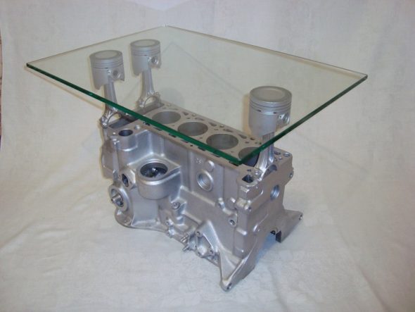 coffee table from a classic block on three pistons and glass