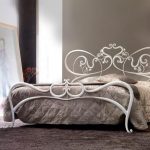White wrought beds look not just airy