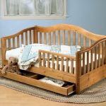 Children's wooden bed with sides photo