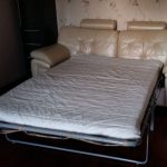 sofa bed with orthopedic mattress in the bedroom