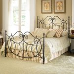 Forged bed in the bedroom, a chest in the interior