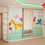 Sliding wardrobe in the children's room with a picture