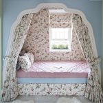 canopy bed by the window