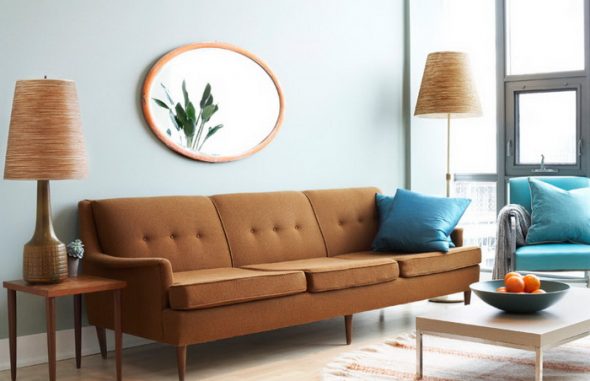 brown sofa with blue pillows