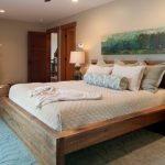 wooden bed in the bedroom interior