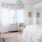 bedroom with light mirror