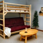 Children's bunk bed made of wood with a sofa