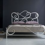 Bedroom design with forged bed