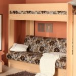 Bunk bed with a sofa in the nursery - living room and bedroom together