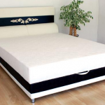 Double bed with orthopedic mattress