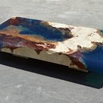 Coffee table in the style of the ocean of stone and resin