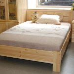 Bed made of solid pine on the photo