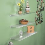 Wall mounted glass shelves look beautiful and elegant.