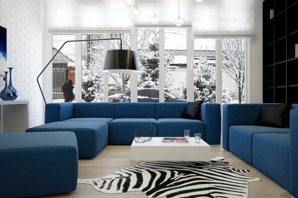 Blue sofa in the interior of the living room