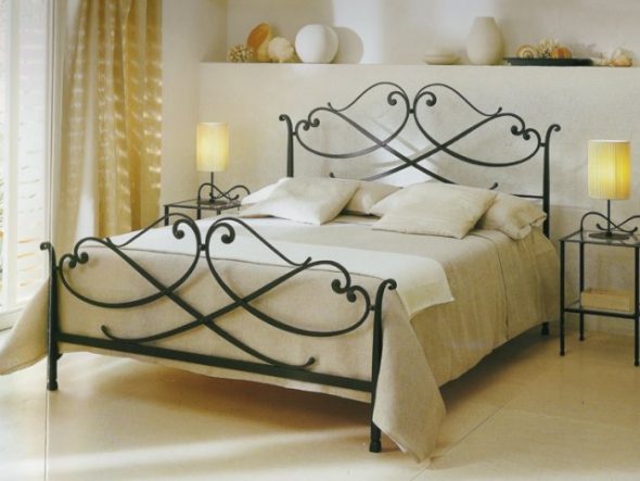 Modern wrought bed in the interior of the bedroom image